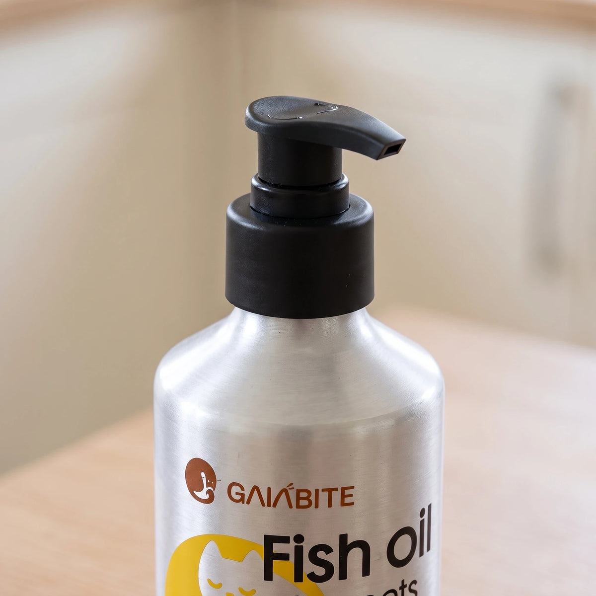 Close-up of the GAIABITE fish oil bottle and black pump