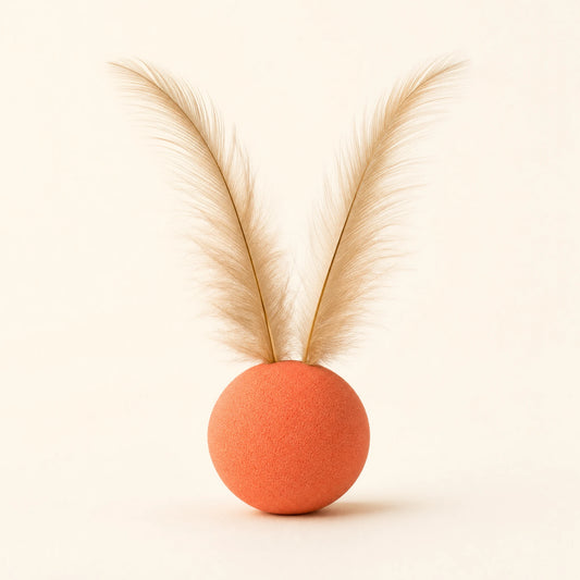 Feather Ball Pet Toy: coral-orange foam ball with two natural feathers